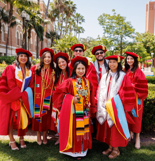 Photo of group of USC students at graduation.