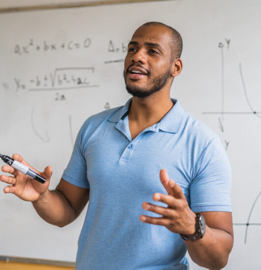 Photo of math teacher in the classroom.