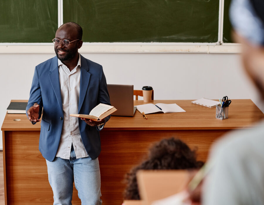 Teacher reading lecture at university