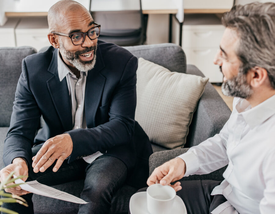 Two men discussing business in a casual setting